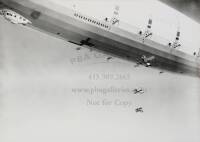 14 gelatin silver photogaphs of the dirigible USS Macon, each with its negative