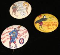 Two 'What Did the Woggle Bug Say?' buttons and an advertising button for 'The Scarecrow of Oz"