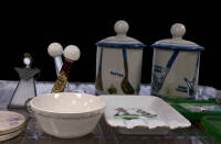 Shelves of golf ceramics, glass and other collectibles