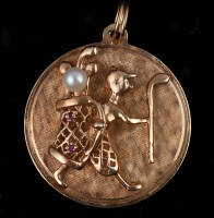 Gold medal pendant of a golfer figurine, mounted to circular medal, engraved for "P.B.G.C. '59 Class A Ringer"