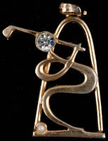 Gold pendant by Medici, of an abstract golfing figure