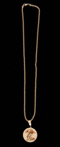 14K gold pendant of a golf club bag with three mounted rubies