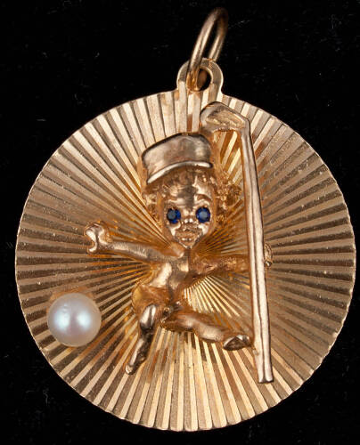 14K gold pendant of cherub holding a golf club, with mounted pearl and sapphire chips