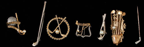 Seven gold or silver pins, each with a mounted pearl