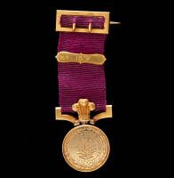Gold medal with purple ribbon attached, from the North Devon & West of England Golf Club, 1879