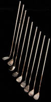 Ten silver swizzle sticks, shaped like golf clubs