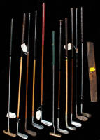 Group of metal shafted clubs, several covered in pyrotone - plus lawnmower blade used on the fairway at the Masters