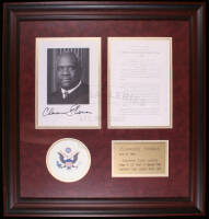 Framed presentation, with: signed photo, U.S. Supreme Court official statement, E. Pluribus Union symbol and brass achievements plaque