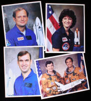 Signed photographs of four of the five astronauts on Space Shuttle flight STS-7 aboard the Challenger, including Sally Ride