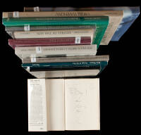 Eleven volumes of photography, each signed