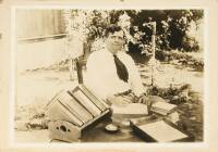 Original photograph of Jack London outside his home, writing