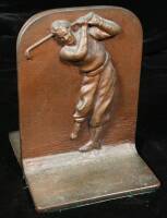 A pair of bronze-plated golfing bookends